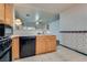 Kitchen featuring black appliances and light wood cabinetry at 2935 Kensington St, Las Vegas, NV 89156