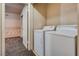 Well-lit laundry room with appliances and additional storage space at 2935 Kensington St, Las Vegas, NV 89156