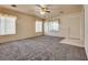 Bright and airy living room with plush gray carpeting, abundant natural light, and neutral paint at 2935 Kensington St, Las Vegas, NV 89156