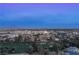 Aerial view of the property and surrounding area at dusk at 3111 Bel Air Dr # 18F, Las Vegas, NV 89109