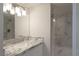 Bathroom with marble vanity and walk-in shower at 3111 Bel Air Dr # 18F, Las Vegas, NV 89109