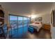 Bright bedroom with city views and dark hardwood floors at 3111 Bel Air Dr # 18F, Las Vegas, NV 89109