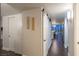 Bright hallway with dark hardwood floors and modern barn door at 3111 Bel Air Dr # 18F, Las Vegas, NV 89109