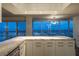 Modern kitchen boasts expansive windows and city views at 3111 Bel Air Dr # 18F, Las Vegas, NV 89109