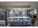 Modern kitchen island with seating and sleek white cabinetry at 3111 Bel Air Dr # 18F, Las Vegas, NV 89109