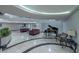 Lobby with seating area, grand piano, and marble floors at 3111 Bel Air Dr # 18F, Las Vegas, NV 89109