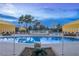 Relaxing pool area with yellow umbrellas and city views at 3111 Bel Air Dr # 18F, Las Vegas, NV 89109