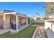 Landscaped backyard with a patio, providing ample outdoor space at 348 Wild Plum Ln, Las Vegas, NV 89107