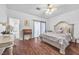 Spacious bedroom with ornate bed frame and hardwood floors at 348 Wild Plum Ln, Las Vegas, NV 89107