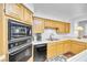 View of kitchen's sink, microwave, and double oven at 348 Wild Plum Ln, Las Vegas, NV 89107