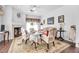 Cozy living room with fireplace, hardwood floors, and comfortable seating arrangement at 348 Wild Plum Ln, Las Vegas, NV 89107