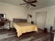 Bedroom with ceiling fan, queen bed, and wood-look floors at 3495 Greenwood Springs Dr, Las Vegas, NV 89122