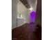 Upstairs hallway with wood flooring and purple accent lighting at 3495 Greenwood Springs Dr, Las Vegas, NV 89122