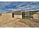 Backyard featuring gravel, an enclosed patio, and desert landscaping at 360 S Blagg Rd, Pahrump, NV 89048