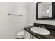 Bathroom with granite vanity and a toilet at 3701 Guinevere Ave, Las Vegas, NV 89110