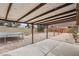 Backyard patio with pergola and partial view of yard at 3701 Guinevere Ave, Las Vegas, NV 89110