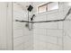 Modern shower with white tile and a rain shower head at 3701 Guinevere Ave, Las Vegas, NV 89110