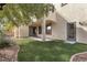 Covered patio with artificial turf and gravel at 3721 Alcantara Ln, North Las Vegas, NV 89084