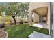 Covered patio with artificial turf and gravel at 3721 Alcantara Ln, North Las Vegas, NV 89084