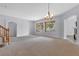 Bright dining room with a chandelier and large windows at 3721 Alcantara Ln, North Las Vegas, NV 89084