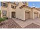 Two-story house with three-car garage and landscaped front yard at 3721 Alcantara Ln, North Las Vegas, NV 89084