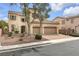 Two-story house with three-car garage and neatly landscaped yard at 3721 Alcantara Ln, North Las Vegas, NV 89084