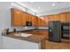 Kitchen with granite counters, stainless steel appliances, and light wood cabinets at 3721 Alcantara Ln, North Las Vegas, NV 89084