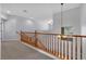 Upper hallway with wood railing and carpet at 3721 Alcantara Ln, North Las Vegas, NV 89084