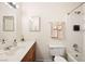 Clean bathroom with wood vanity, bathtub, and shower at 3982 Voxna St, Las Vegas, NV 89119