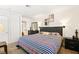 Spacious bedroom with striped bedding and ample closet space at 3982 Voxna St, Las Vegas, NV 89119