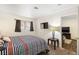 Bedroom with striped bedding and view to living room at 3982 Voxna St, Las Vegas, NV 89119