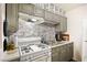 Modern kitchen with gray cabinets and tile backsplash at 3982 Voxna St, Las Vegas, NV 89119