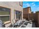 Small patio with seating and sliding glass door access at 4204 Becket Ct, Las Vegas, NV 89129