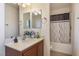 Clean bathroom with a vanity, tub, and shower at 4204 Becket Ct, Las Vegas, NV 89129