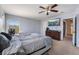 Main bedroom with large TV, dresser, and ceiling fan at 4204 Becket Ct, Las Vegas, NV 89129