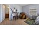 Cozy bedroom with a vanity, comfortable chair, and playful rug at 4204 Becket Ct, Las Vegas, NV 89129