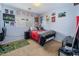 Bright bedroom with a double bed, gaming setup and colorful decor at 4204 Becket Ct, Las Vegas, NV 89129