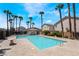 Inviting community pool with palm trees and a cabana at 4204 Becket Ct, Las Vegas, NV 89129