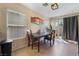 Formal dining room featuring a wood table and access to backyard at 4204 Becket Ct, Las Vegas, NV 89129