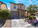 Two-story house with attached garage and landscaping at 4204 Becket Ct, Las Vegas, NV 89129