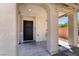 Home's front entrance with black metal door and porch at 4204 Becket Ct, Las Vegas, NV 89129