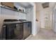 Convenient laundry room with washer, dryer and shelving at 4204 Becket Ct, Las Vegas, NV 89129