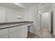 Bathroom with white cabinets, grey countertops, and a walk-in shower at 4219 Gold Desert St, North Las Vegas, NV 89032