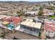 Aerial view of house, pool, and surrounding neighborhood at 505 Ville Dr, Boulder City, NV 89005