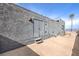 Private backyard with concrete patio and storage at 505 Ville Dr, Boulder City, NV 89005