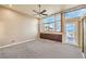 Bright bedroom with large windows, carpet flooring, and access to a balcony at 505 Ville Dr, Boulder City, NV 89005