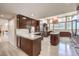 Modern kitchen with dark wood cabinets, a large island, and stainless steel appliances at 505 Ville Dr, Boulder City, NV 89005