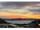 Stunning sunset over lake and mountains; breathtaking vista at 505 Ville Dr, Boulder City, NV 89005