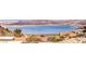 Panoramic lake view with mountain backdrop; serene and picturesque setting at 505 Ville Dr, Boulder City, NV 89005