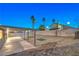 Backyard patio at night with putting green at 5117 Dancer Way, Las Vegas, NV 89107